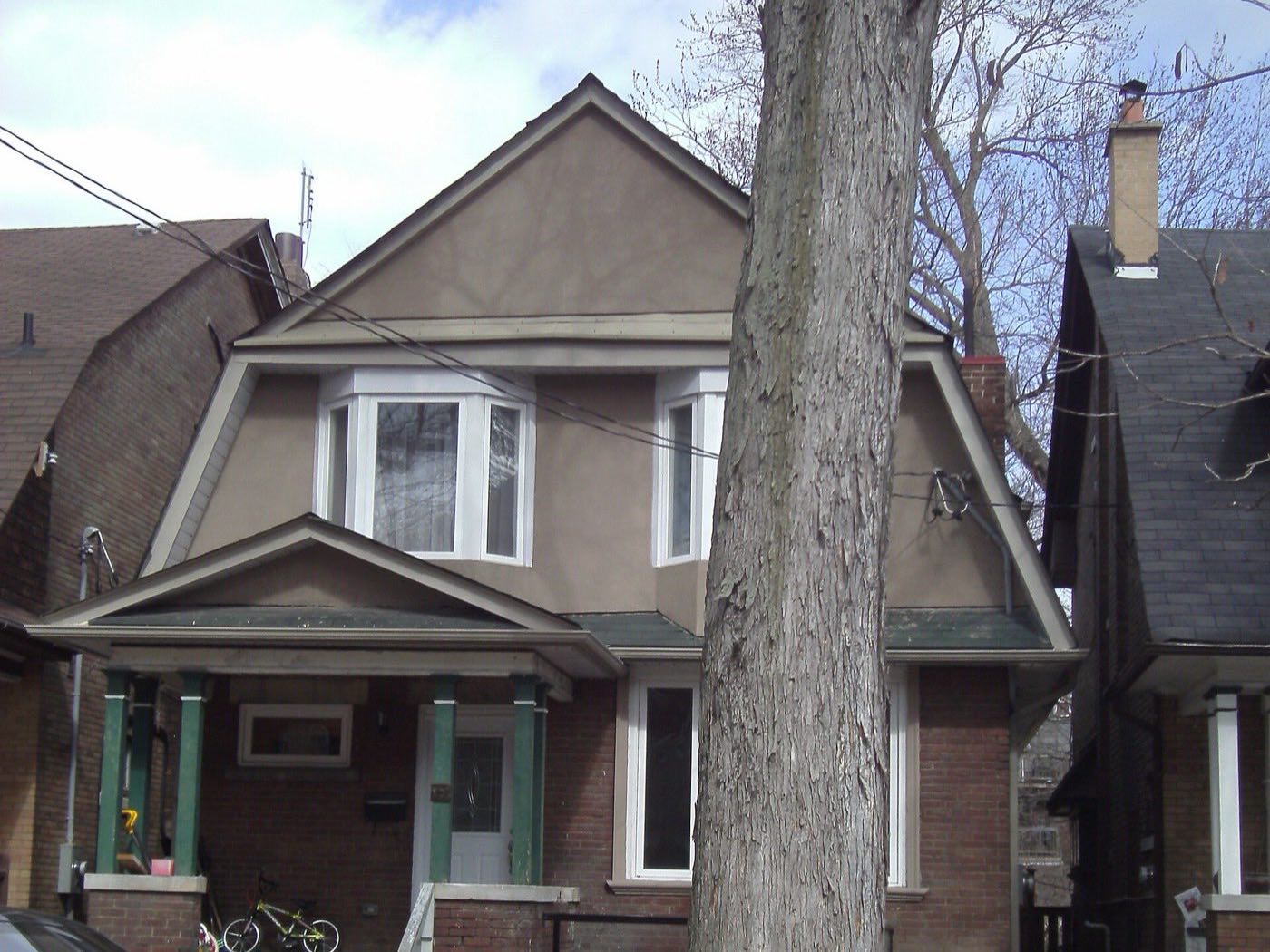 House with a gabled roof and front porch in the Annex, Toronto