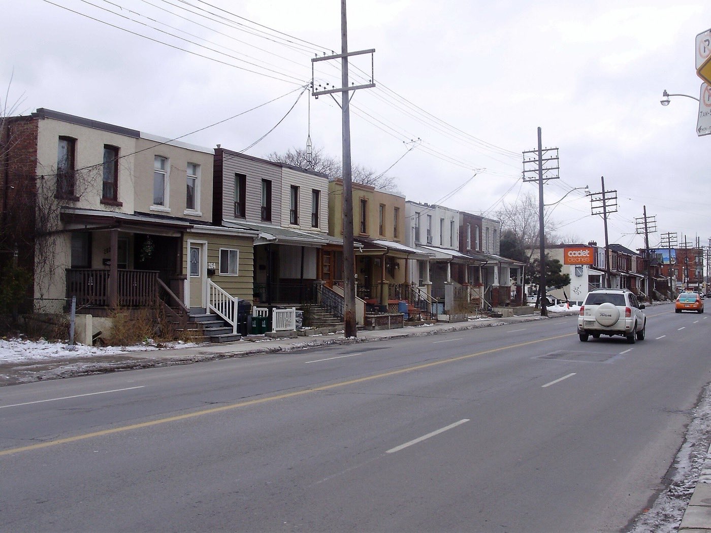 Row of houses with covered porches on Old Weston Road, Toronto